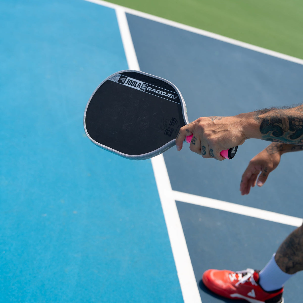 Close-up of the JOOLA Pro V Radius 16mm Pickleball Paddle face on court